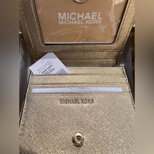 BRAND NEW! Michael Kors gold wallet in box.